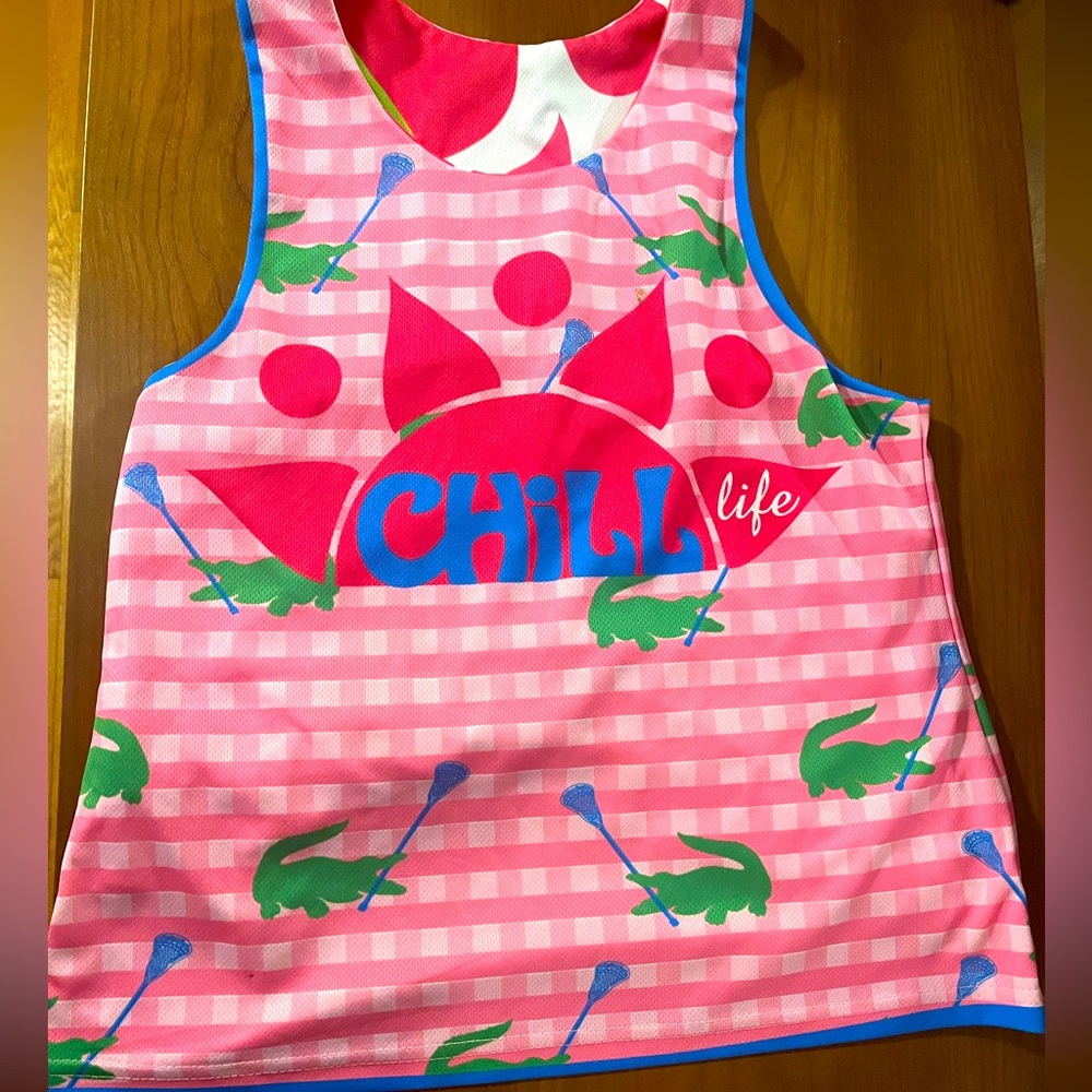 Chilll life lacrosse pinney. Reversible. No size but looks like a kids small.